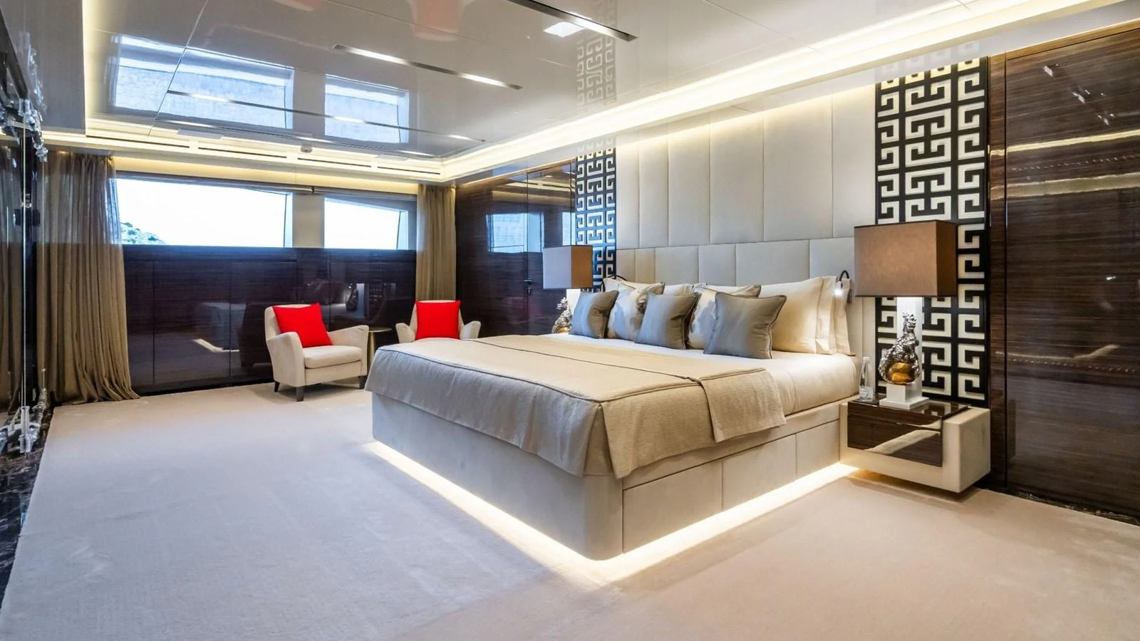 The master stateroom features a luxurious bed, elegant decor, and ample natural light. aboard BLUE MOON Yacht for Sale