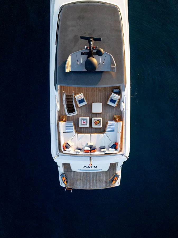 The yacht's aft deck offers a luxurious space with comfortable seating and a serene ambiance. aboard CALM Yacht for Sale