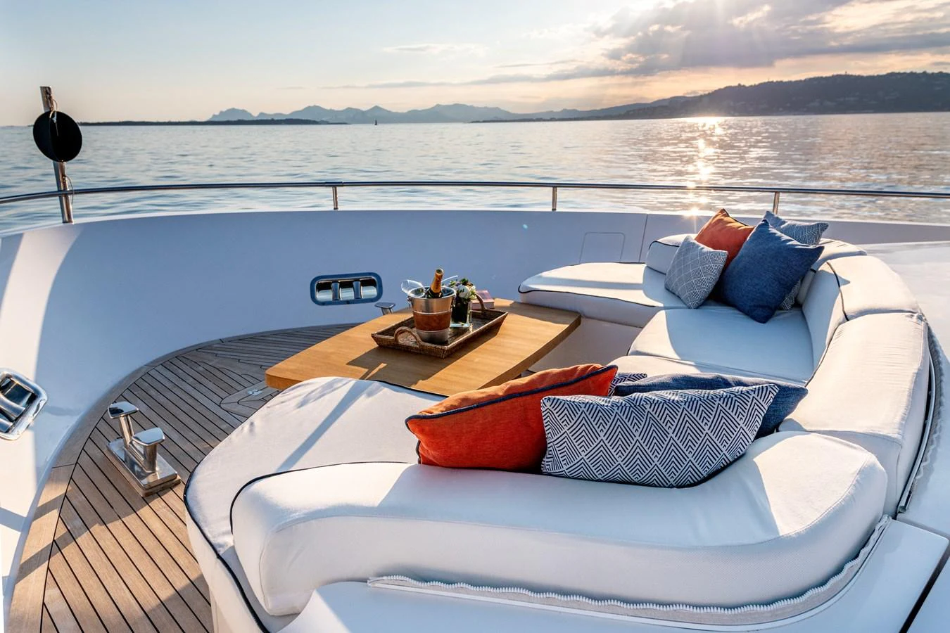 The sundeck offers a luxurious lounging area with plush seating and a stunning view of the water. aboard CALM Yacht for Sale