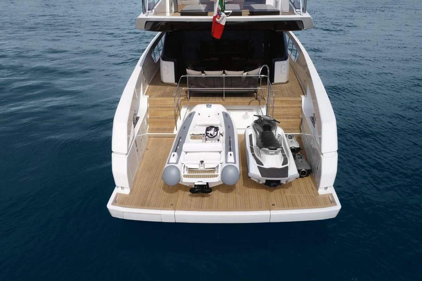 The aft deck features a tender and a jet ski, ready for water adventures. aboard SANLORENZO SX 76 KYOMU Yacht for Sale