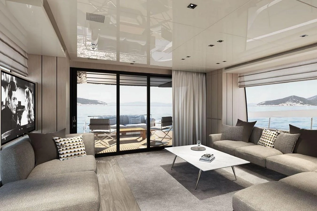 The salon offers a spacious and elegant area with comfortable seating and a stunning view of the sea through large windows. aboard SANLORENZO SX 76 KYOMU Yacht for Sale