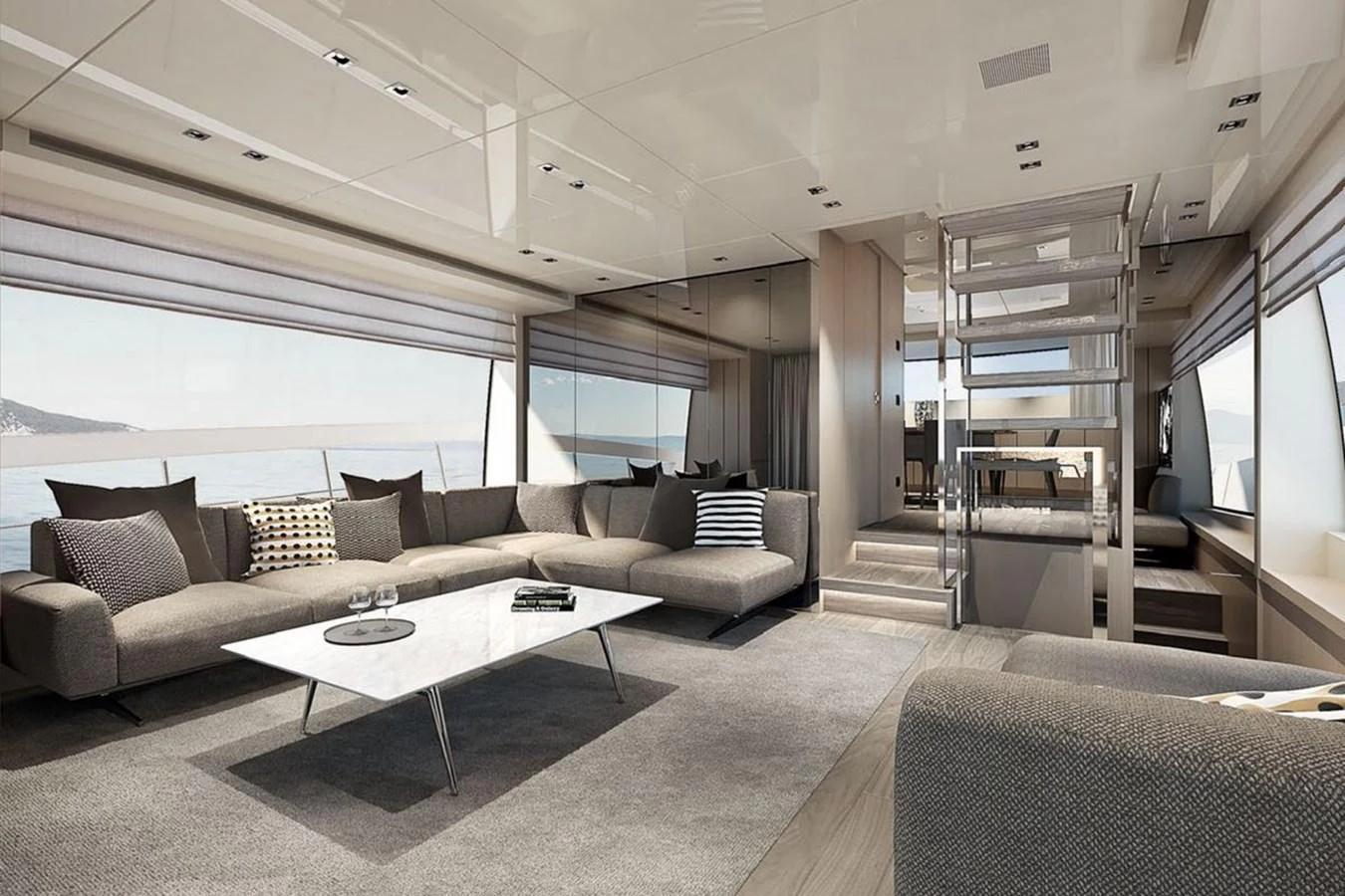 The yacht's salon features modern furnishings and large windows offering stunning sea views. aboard SANLORENZO SX 76 KYOMU Yacht for Sale