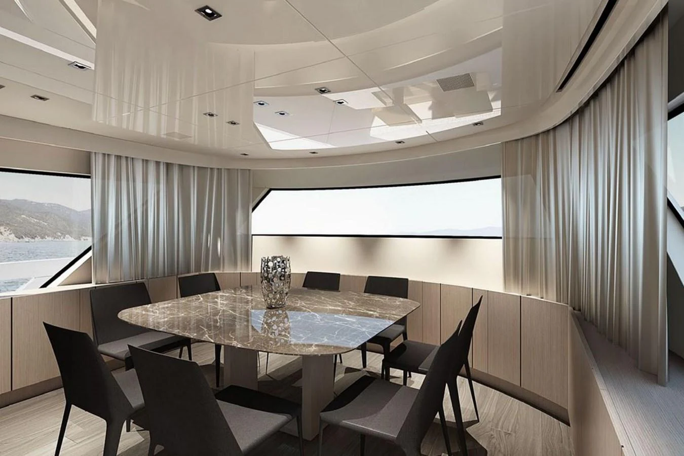 The yacht's dining area features a sleek table surrounded by modern chairs, with large windows offering scenic views. aboard SANLORENZO SX 76 KYOMU Yacht for Sale
