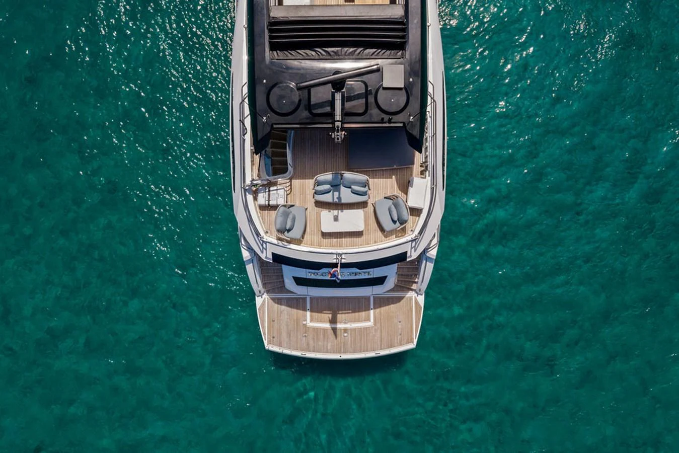 The yacht's aft deck offers a luxurious space for relaxation and enjoyment on the water. aboard DOLCE FAR NIENTE Yacht for Sale