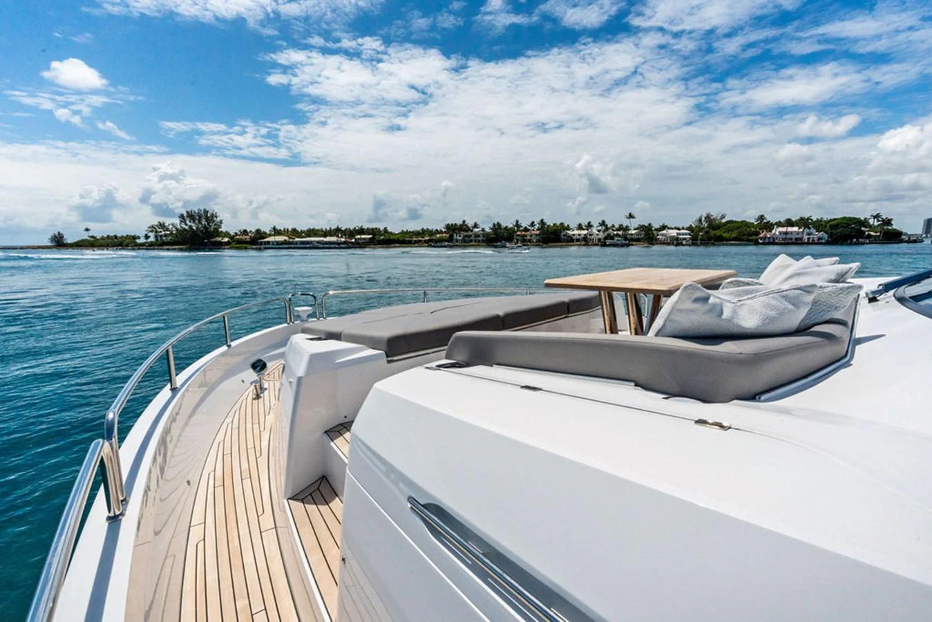 The yacht's foredeck offers a luxurious lounging area with plush seating and a stunning view of the water. aboard DOLCE FAR NIENTE Yacht for Sale