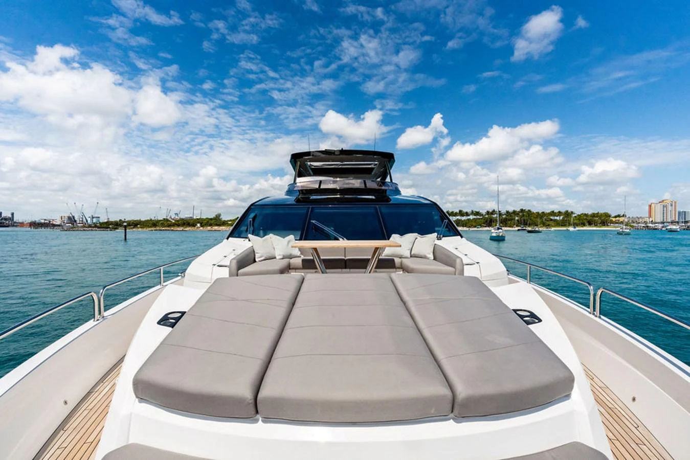 The foredeck features luxurious sun pads and a sleek design, perfect for relaxation and enjoying the view. aboard DOLCE FAR NIENTE Yacht for Sale