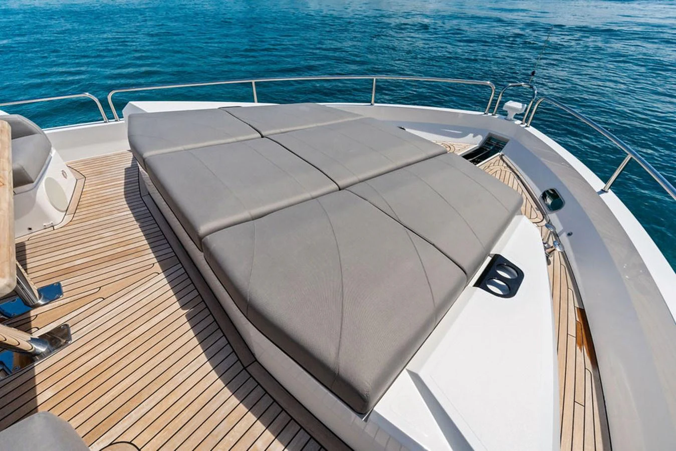The foredeck features a spacious sunbathing area with comfortable cushions, perfect for relaxation. aboard DOLCE FAR NIENTE Yacht for Sale