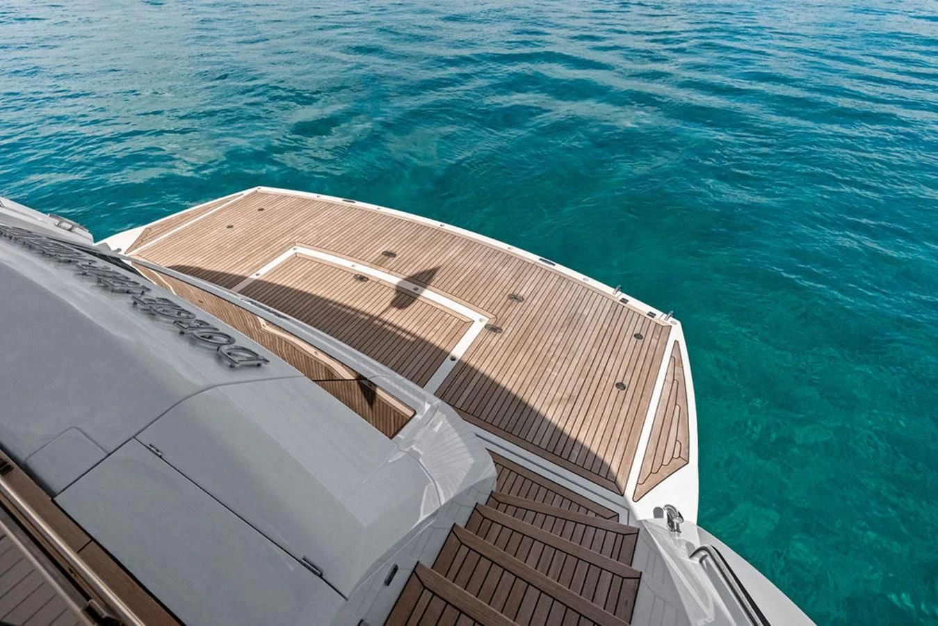 The yacht features a spacious swim platform with elegant teak decking, perfect for easy access to the water. aboard DOLCE FAR NIENTE Yacht for Sale