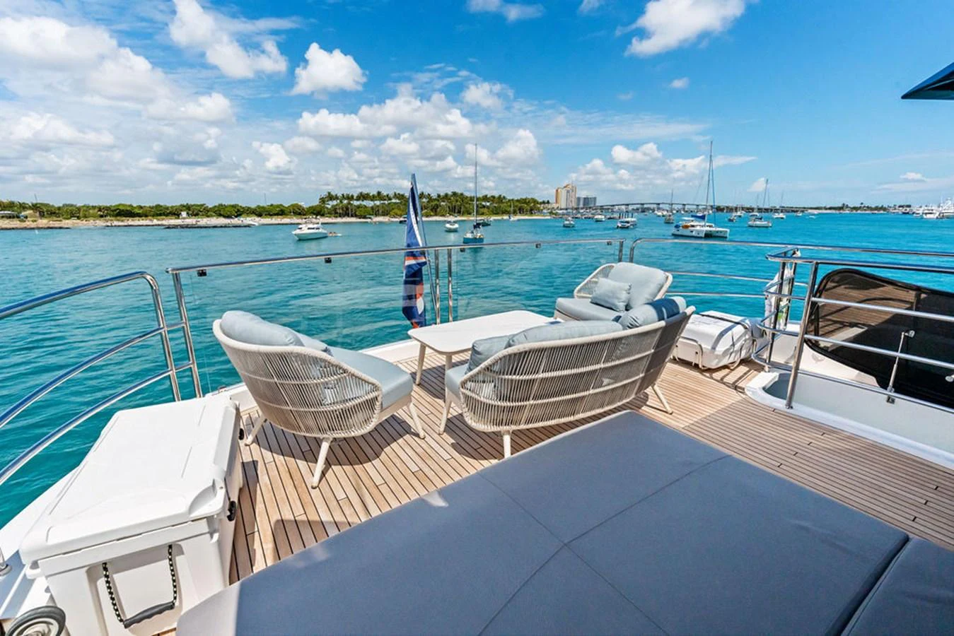The aft deck offers a relaxing outdoor seating area with stunning views of the marina. aboard DOLCE FAR NIENTE Yacht for Sale