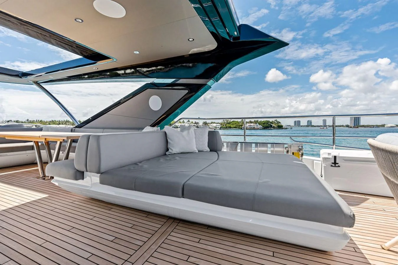 The sundeck features a luxurious lounging area with plush seating and stunning views of the water. aboard DOLCE FAR NIENTE Yacht for Sale