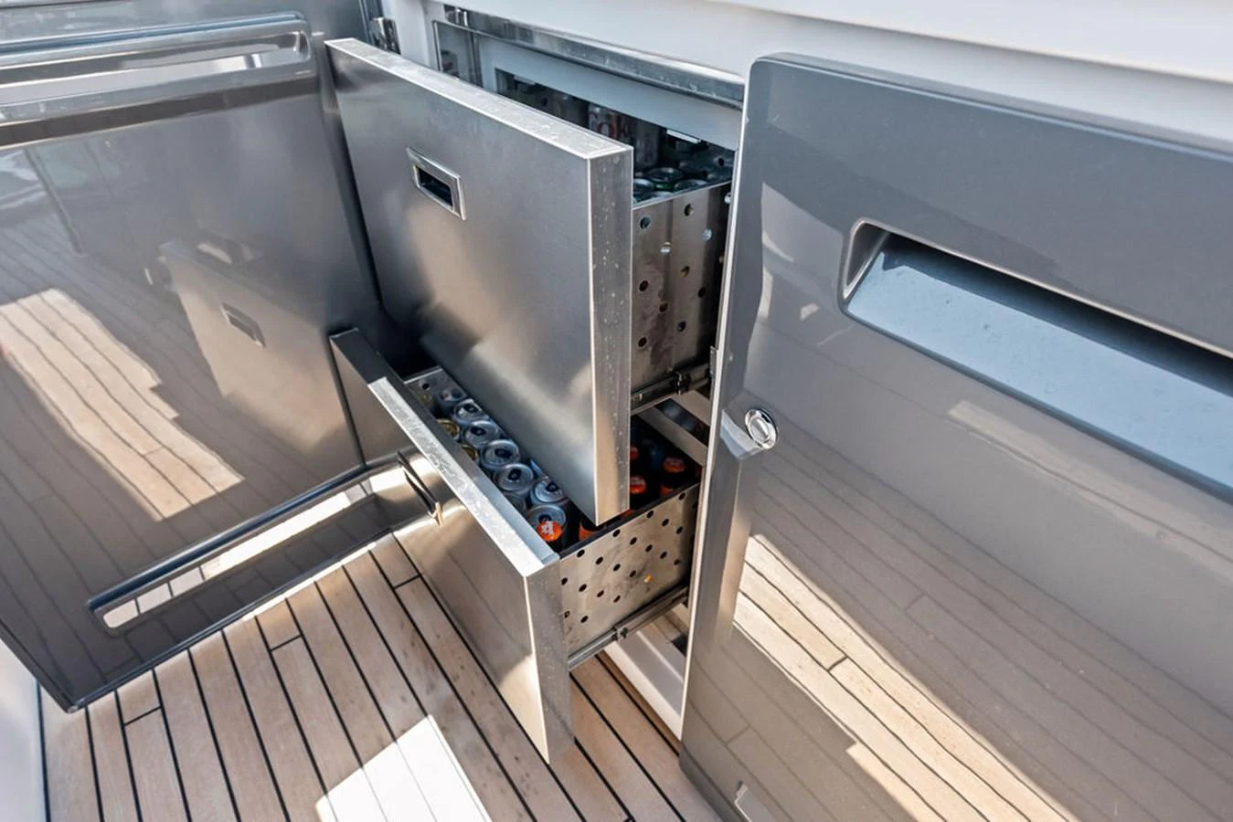 A sleek, built-in refrigerator drawer on the yacht's deck offers convenient access to beverages. aboard DOLCE FAR NIENTE Yacht for Sale