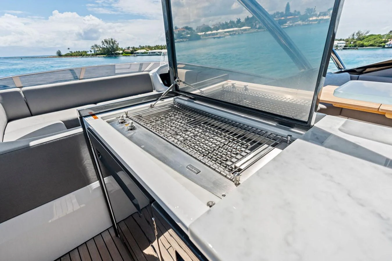 This yacht features a sleek outdoor grill area perfect for alfresco dining. aboard DOLCE FAR NIENTE Yacht for Sale