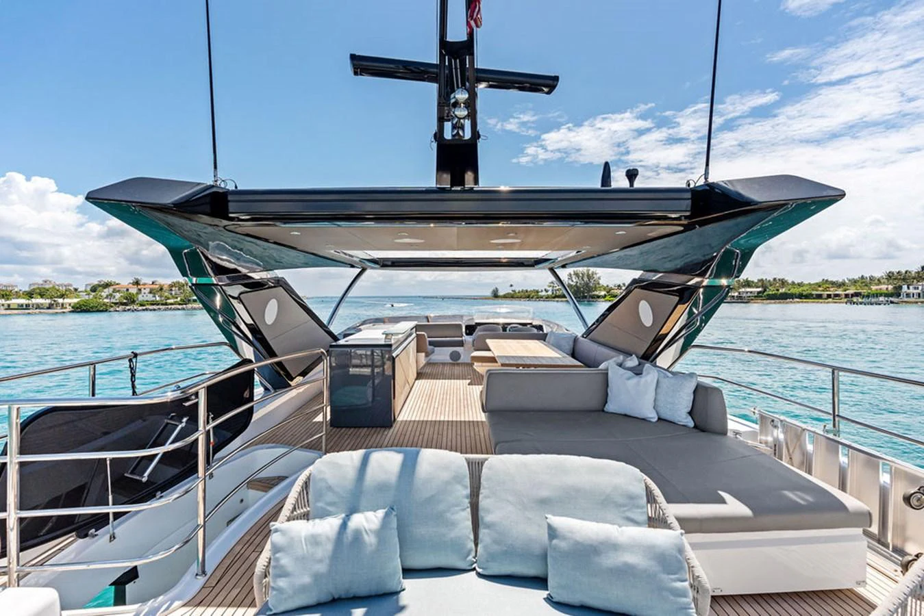 The flybridge offers a spacious and luxurious outdoor lounging area with stunning views of the water. aboard DOLCE FAR NIENTE Yacht for Sale