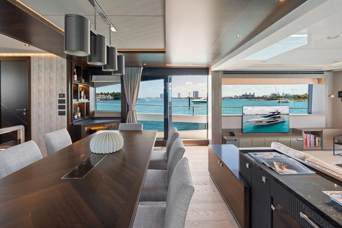 The salon offers a spacious and modern living area with panoramic views of the water. aboard DOLCE FAR NIENTE Yacht for Sale