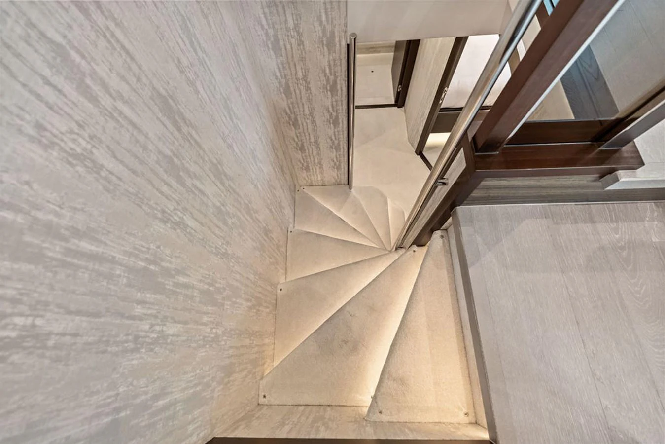 A modern, well-lit staircase with elegant design elements. aboard DOLCE FAR NIENTE Yacht for Sale
