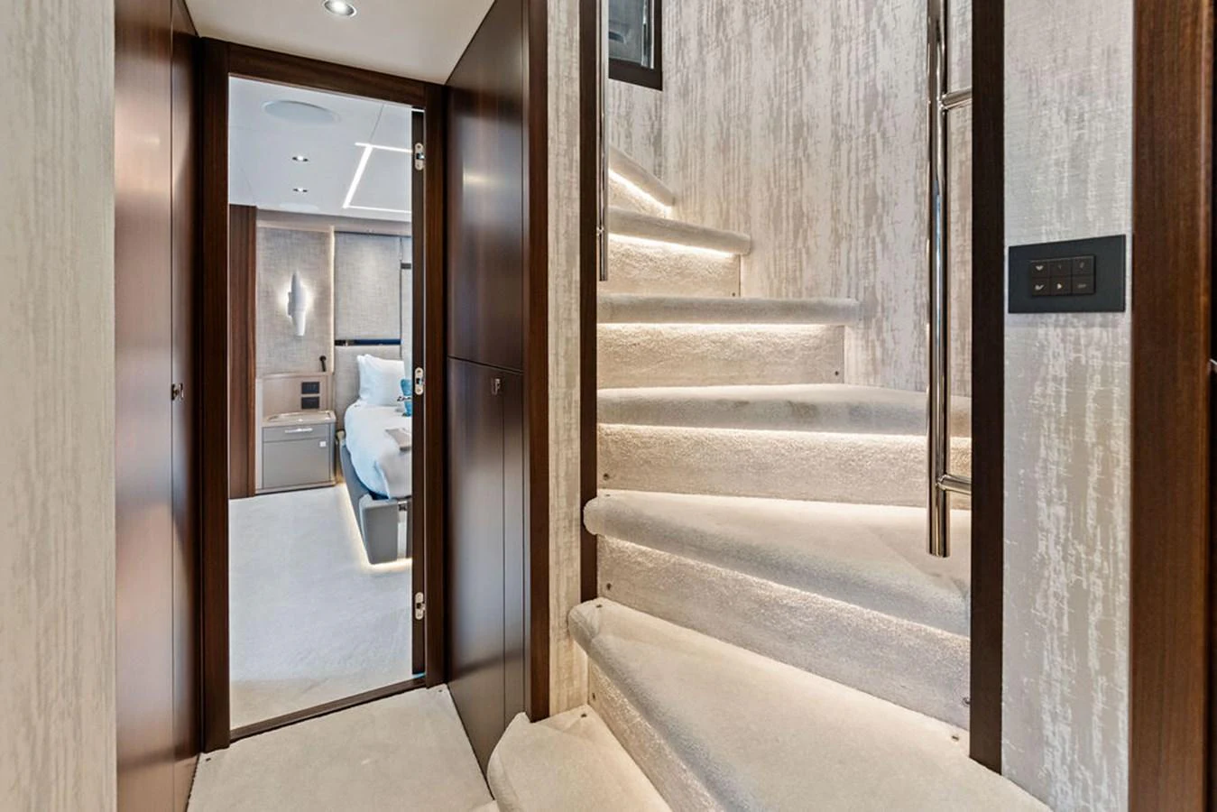 A luxurious staircase with plush carpeting leads to an elegant stateroom. aboard DOLCE FAR NIENTE Yacht for Sale