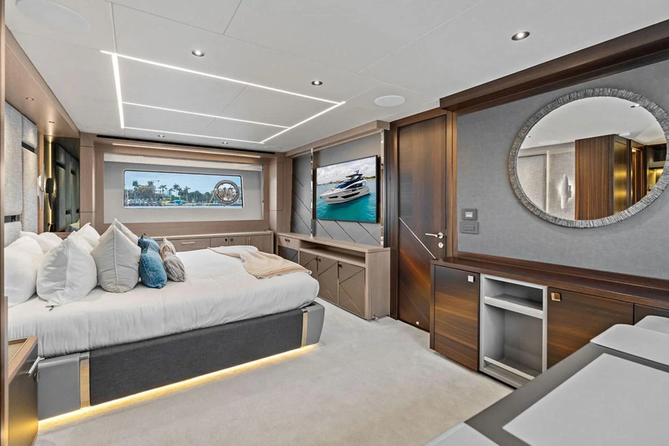 The master stateroom features a luxurious bed, modern decor, and ample natural light. aboard DOLCE FAR NIENTE Yacht for Sale