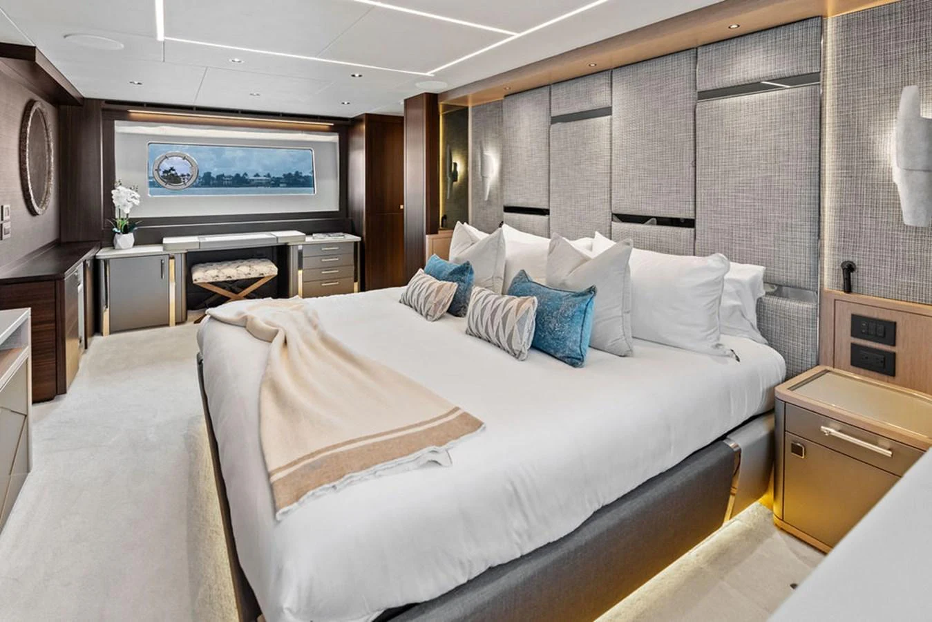 The master stateroom features a luxurious bed with plush pillows and modern decor. aboard DOLCE FAR NIENTE Yacht for Sale