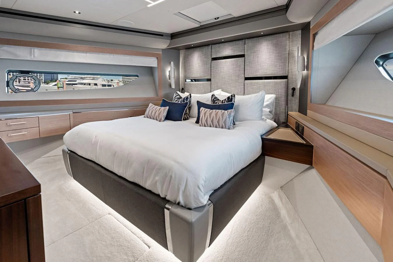The stateroom features a luxurious bed with elegant decor and ample natural light. aboard DOLCE FAR NIENTE Yacht for Sale