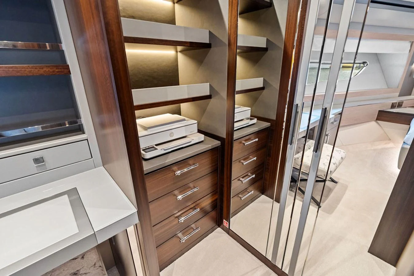 The stateroom features elegant wood cabinetry and mirrored accents, creating a luxurious and spacious feel. aboard DOLCE FAR NIENTE Yacht for Sale