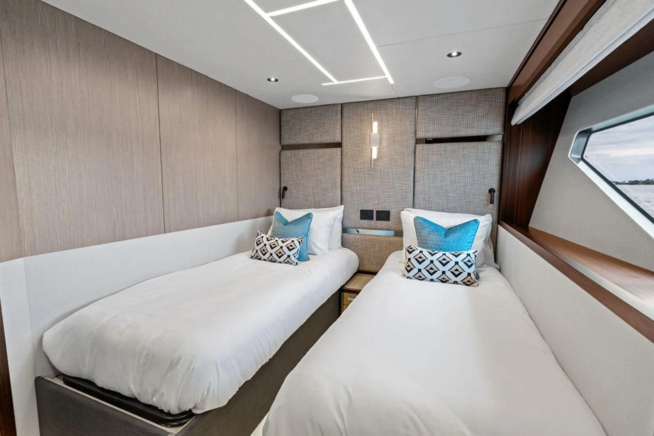 The twin stateroom offers a serene and comfortable sleeping area with modern design elements. aboard DOLCE FAR NIENTE Yacht for Sale