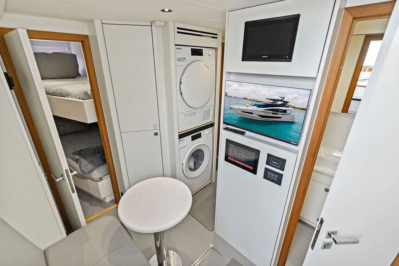 This interior shot showcases a compact and functional laundry area with modern amenities. aboard DOLCE FAR NIENTE Yacht for Sale