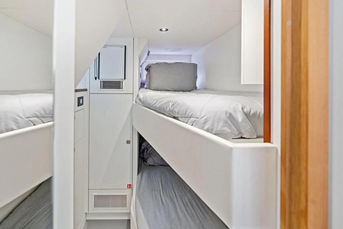 The cozy bunk cabin features neatly arranged beds with soft, inviting linens. aboard DOLCE FAR NIENTE Yacht for Sale