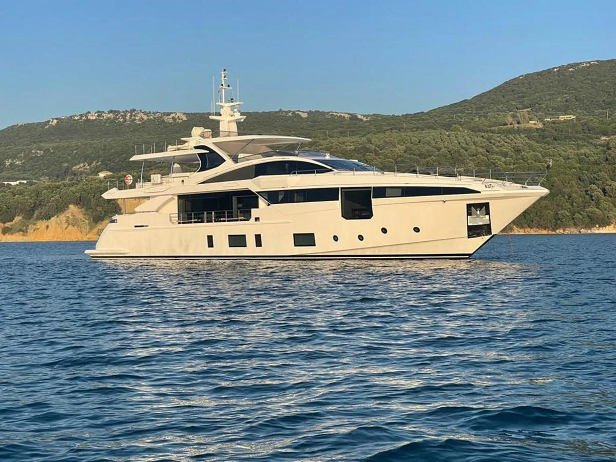 A sleek and modern yacht cruises gracefully on calm waters against a scenic backdrop. aboard DAGUSHA V Yacht for Sale