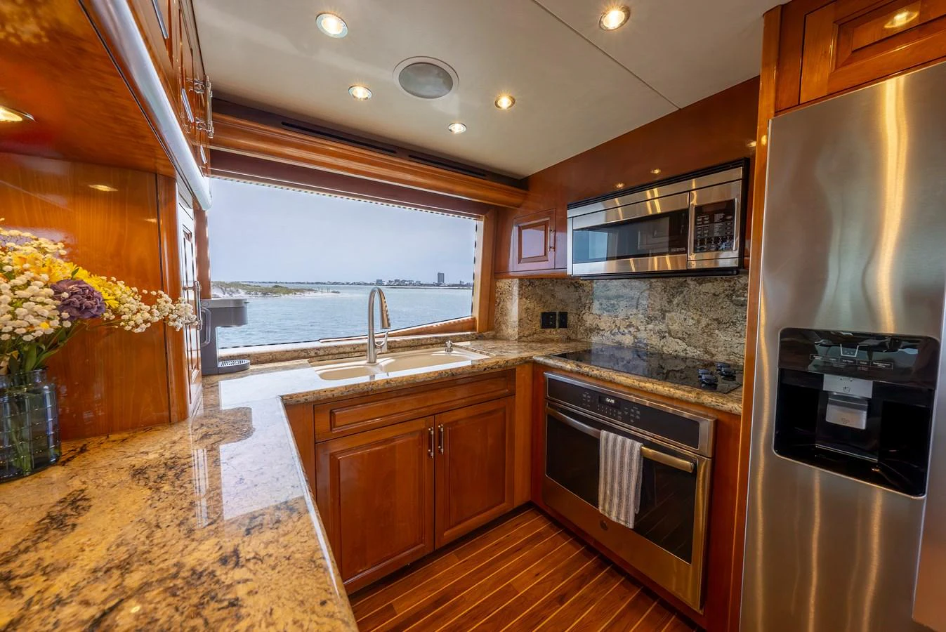 The yacht's galley features modern appliances and a large window with a stunning view. aboard HAVILAH Yacht for Sale