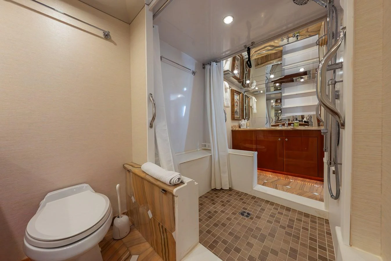 The yacht's bathroom features a spacious shower area and modern fixtures. aboard HAVILAH Yacht for Sale