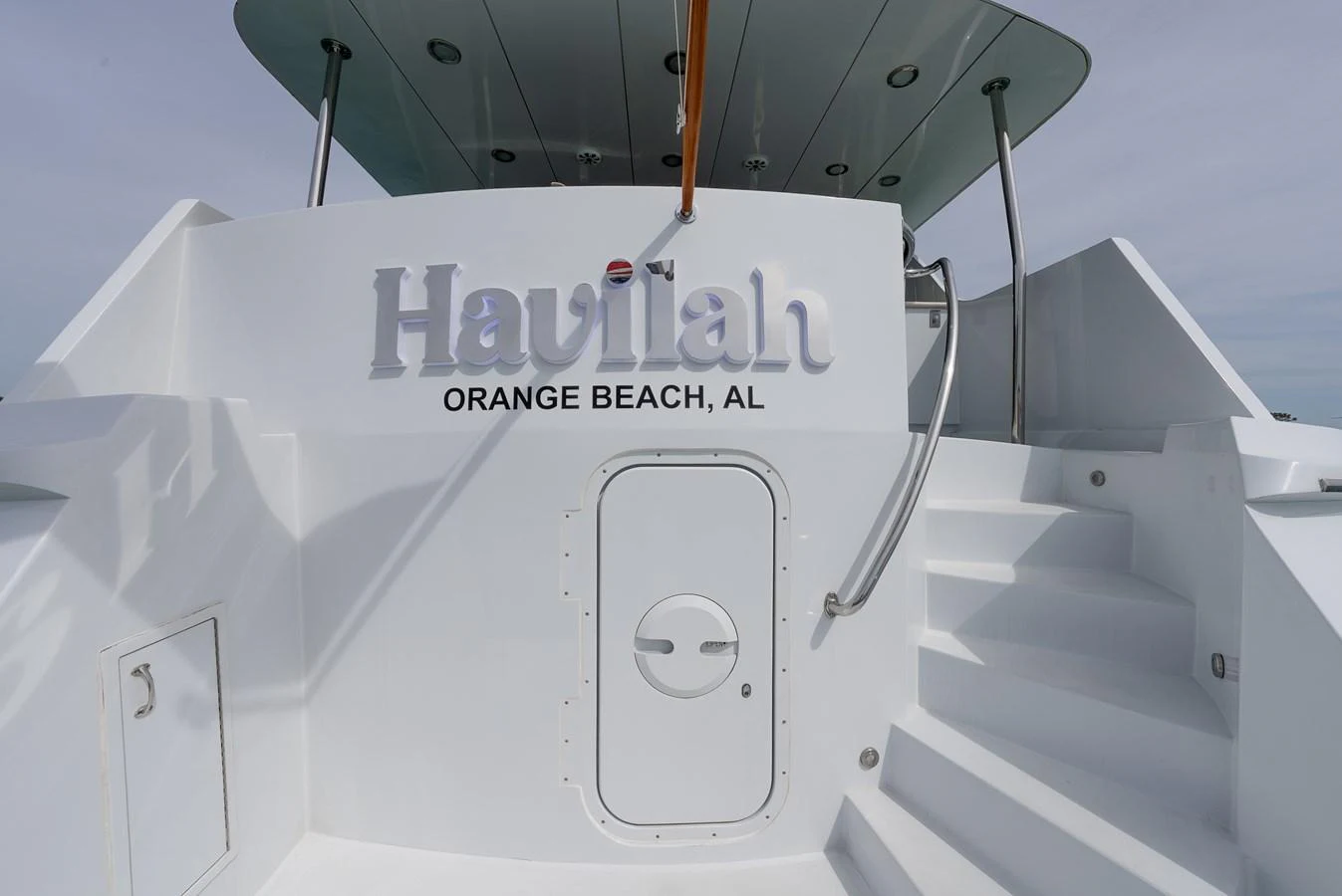 A close-up view of the yacht's stern showcasing its name and home port. aboard HAVILAH Yacht for Sale