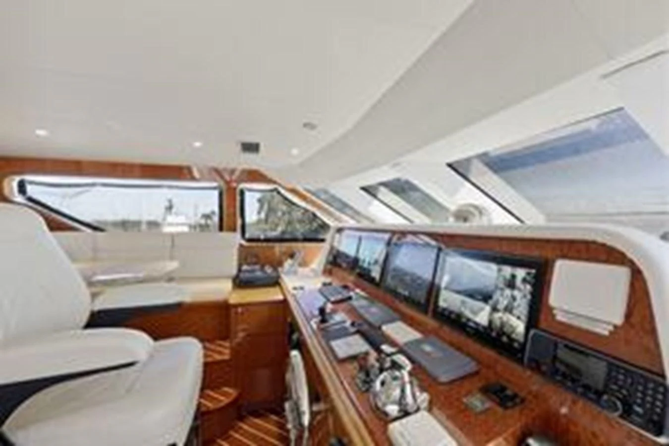The helm station features advanced navigation equipment and luxurious seating. aboard FOOTLOOSE Yacht for Sale