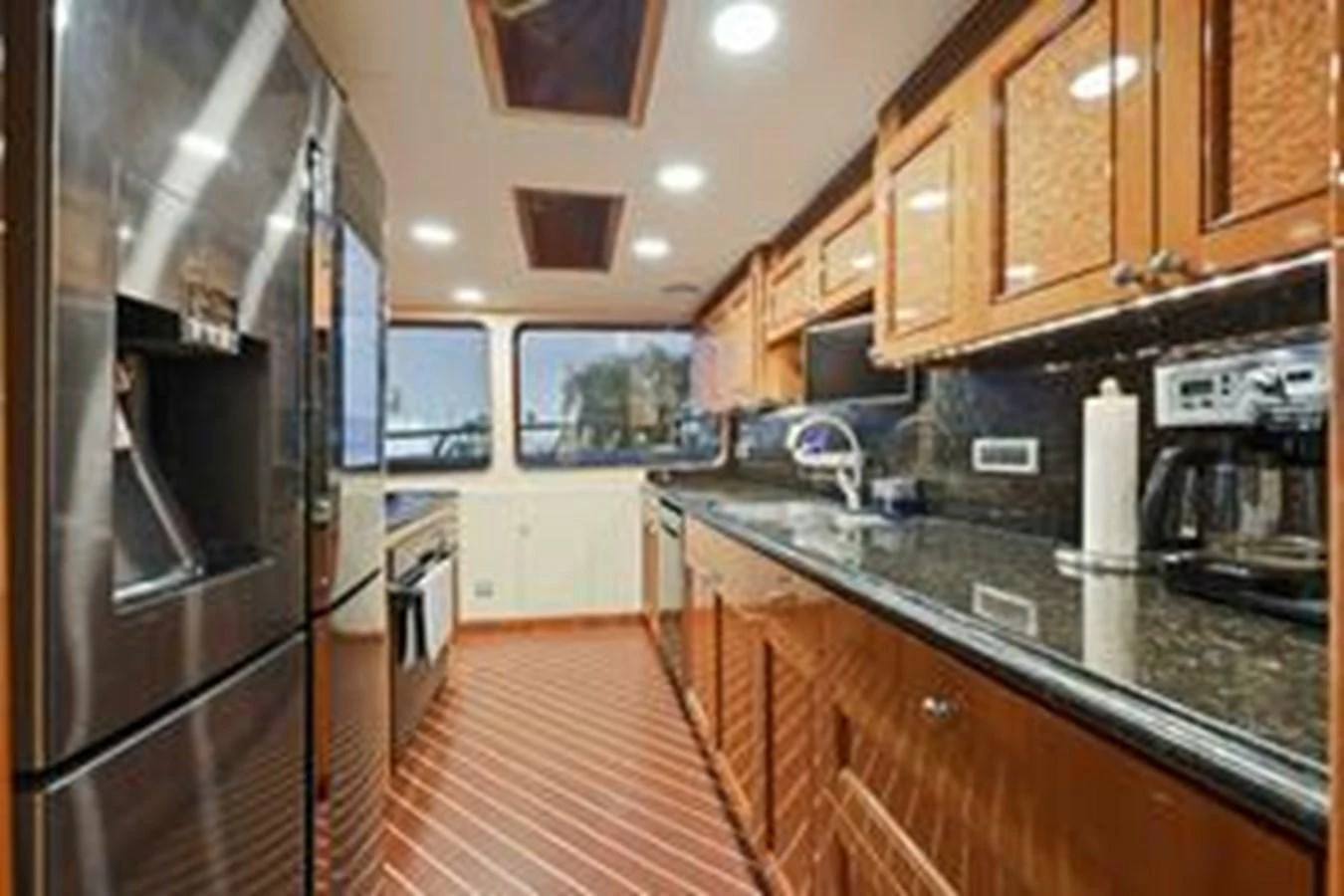 The yacht's galley features modern appliances and ample counter space, creating a functional and stylish cooking area. aboard FOOTLOOSE Yacht for Sale