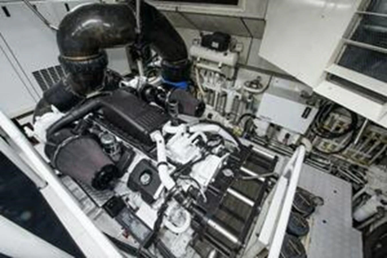 The image showcases the engine room with a detailed view of the yacht's machinery and components. aboard FOOTLOOSE Yacht for Sale