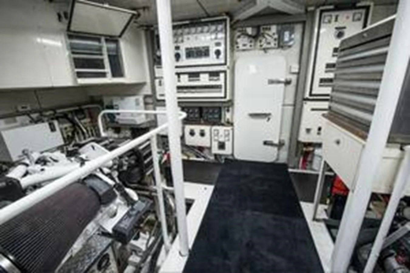 The image showcases the yacht's well-equipped engine room with various control panels and machinery. aboard FOOTLOOSE Yacht for Sale