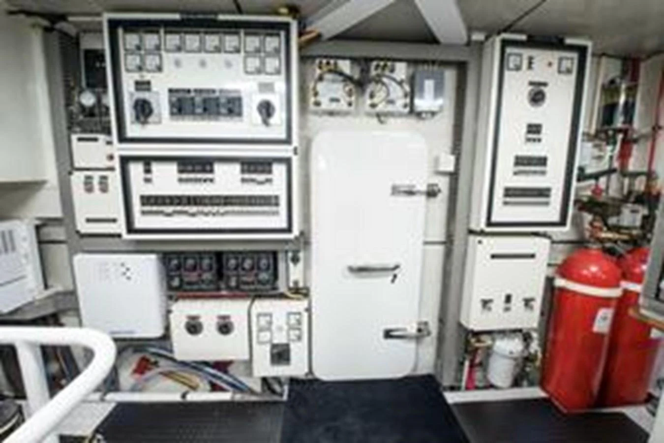 The image showcases the technical control room of the yacht, featuring various control panels and safety equipment. aboard FOOTLOOSE Yacht for Sale