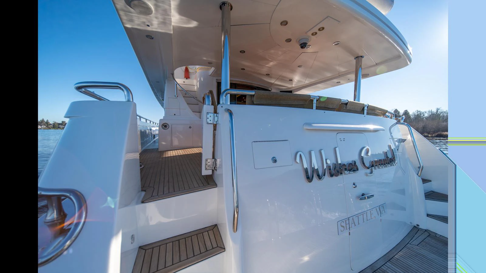 The yacht's aft deck features elegant steps leading to a spacious and inviting area for relaxation. aboard WISHES GRANTED Yacht for Sale