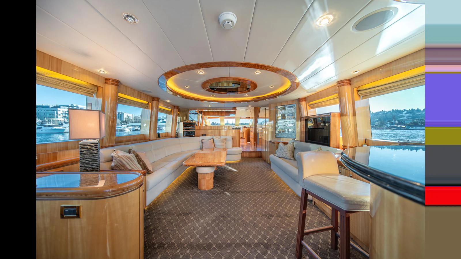 The salon features luxurious seating and panoramic windows for a comfortable and scenic experience. aboard WISHES GRANTED Yacht for Sale