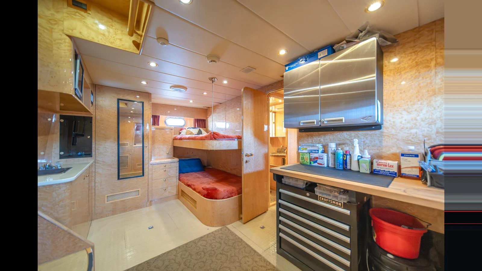 The crew quarters offer a functional and comfortable space with bunk beds and ample storage. aboard WISHES GRANTED Yacht for Sale