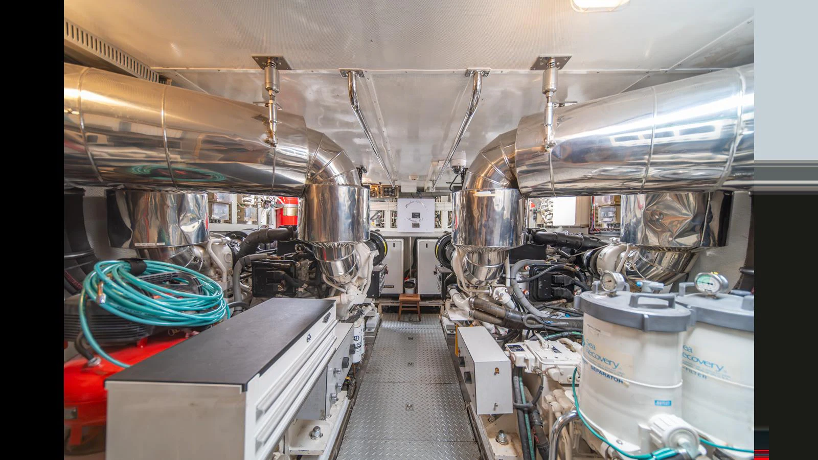 The engine room showcases the yacht's powerful and well-maintained machinery. aboard WISHES GRANTED Yacht for Sale