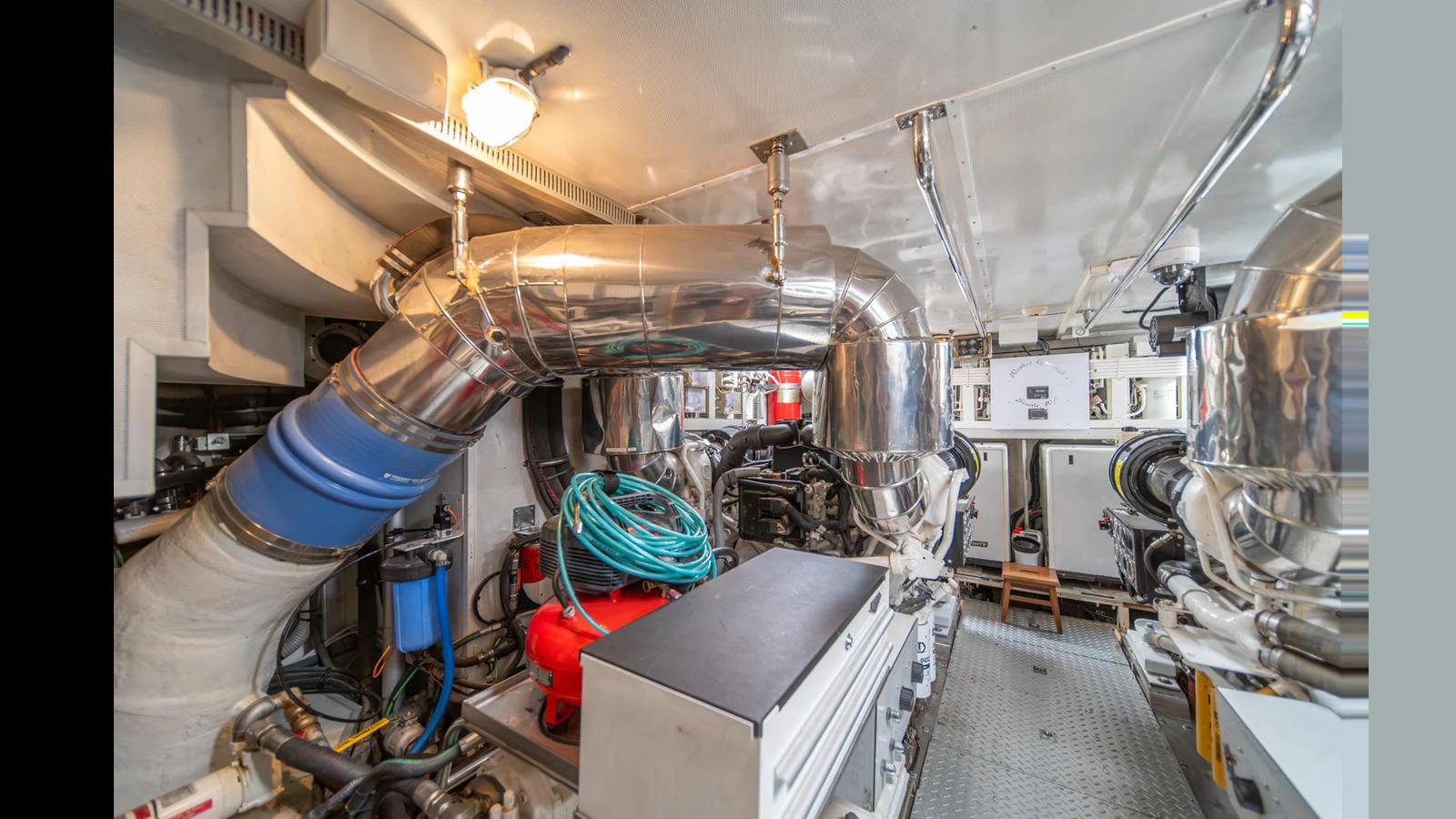 The image showcases the yacht's well-maintained engine room with modern equipment and piping. aboard WISHES GRANTED Yacht for Sale