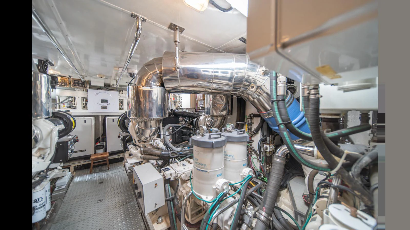 The image showcases the yacht's well-maintained engine room with various mechanical components and systems. aboard WISHES GRANTED Yacht for Sale