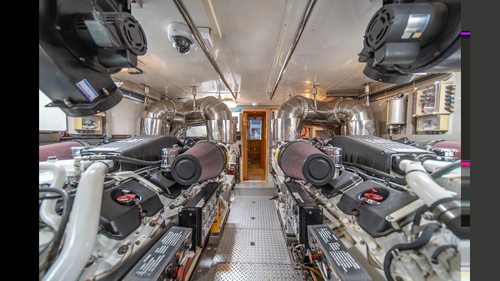 The engine room showcases powerful machinery and a well-organized layout. aboard WISHES GRANTED Yacht for Sale