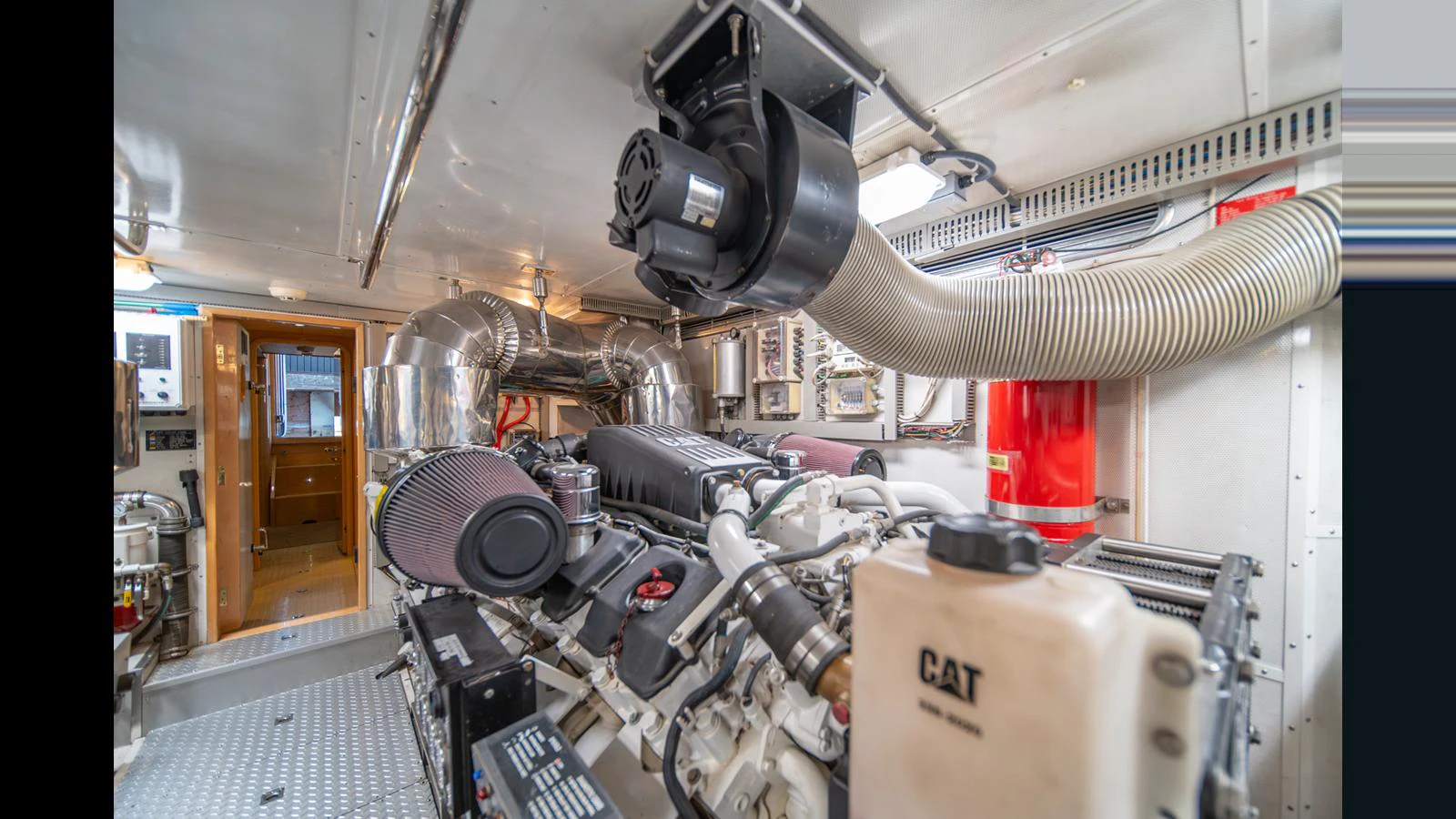 The engine room showcases powerful machinery and a well-organized layout. aboard WISHES GRANTED Yacht for Sale