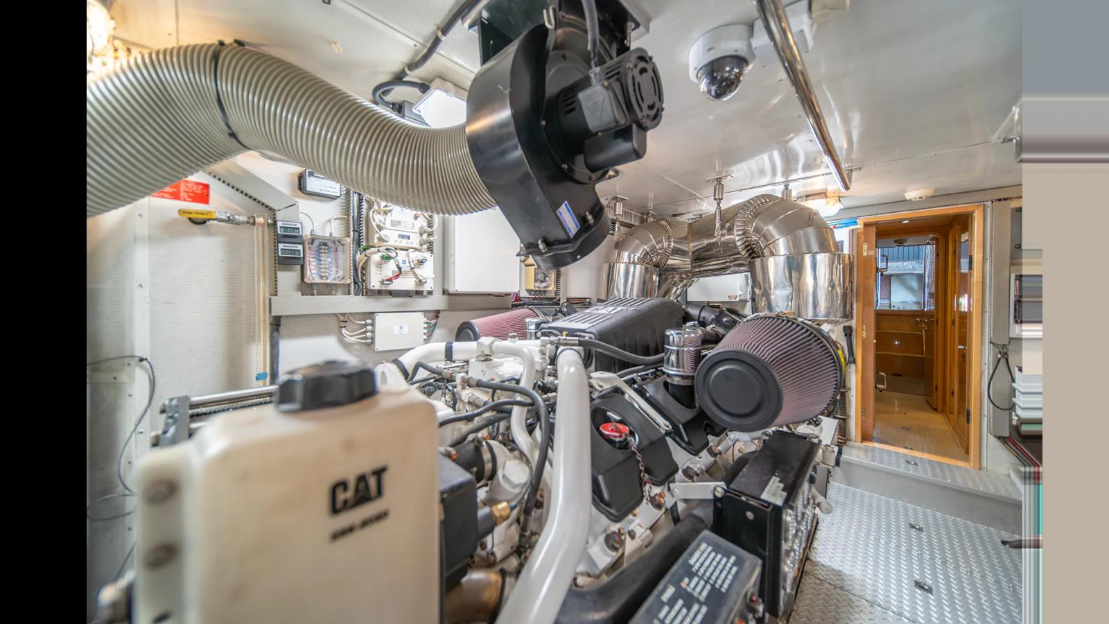 The image showcases the well-maintained engine room of the yacht, highlighting its advanced machinery and clean setup. aboard WISHES GRANTED Yacht for Sale