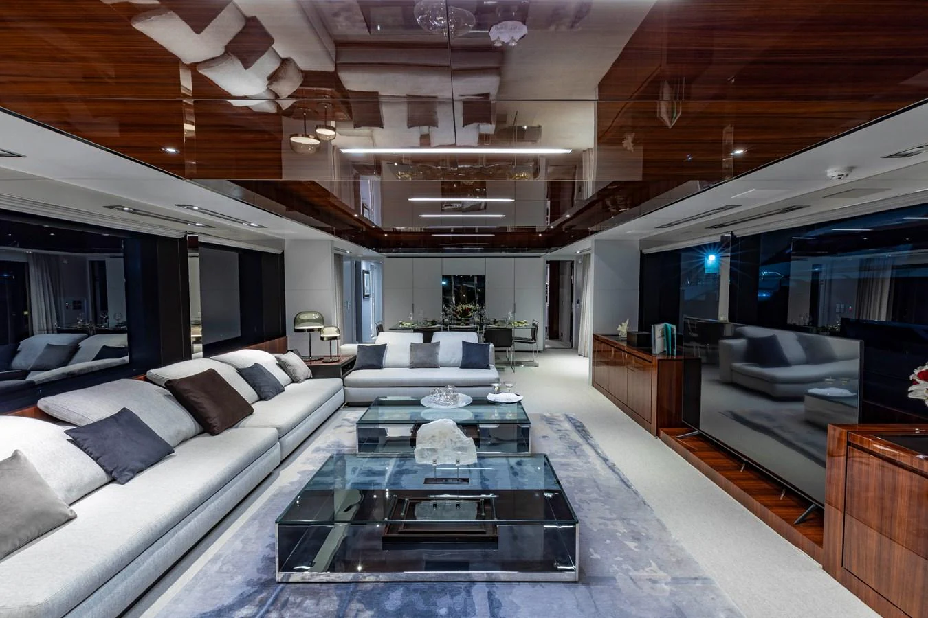 The yacht's salon features luxurious seating and a modern entertainment area. aboard NO SURRENDER Yacht for Sale