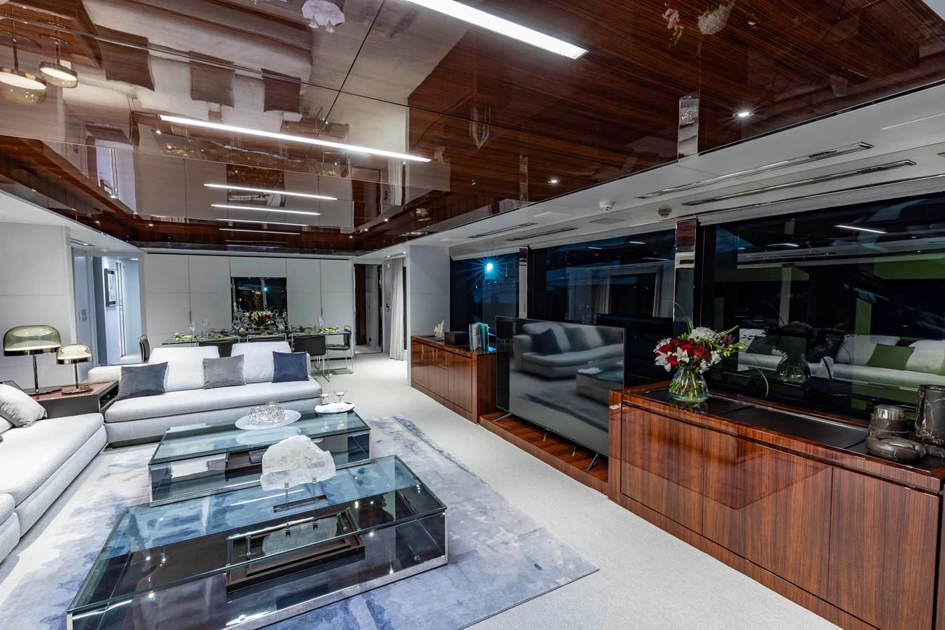 The yacht's salon features modern furnishings and a spacious layout with elegant decor. aboard NO SURRENDER Yacht for Sale