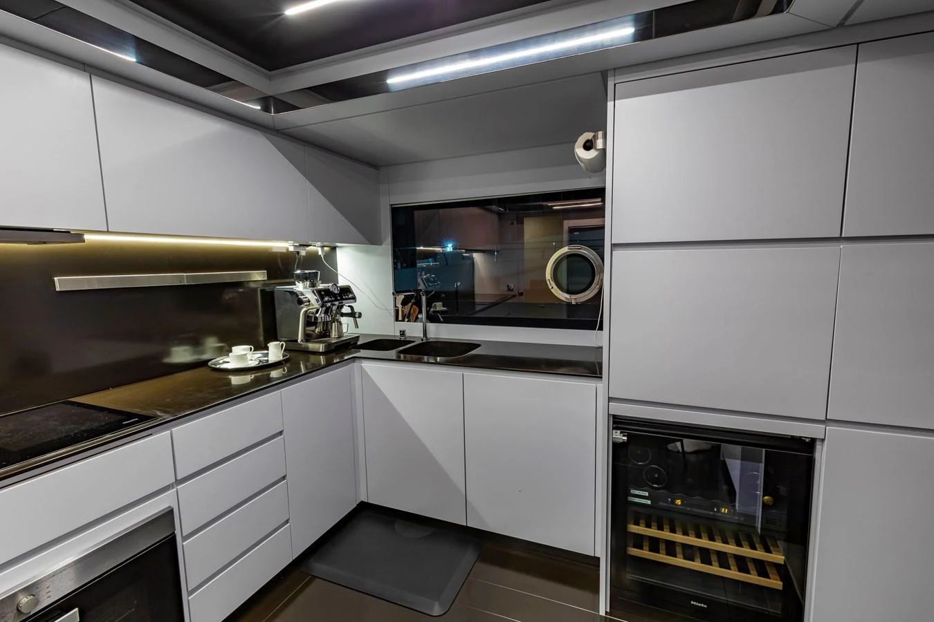 A sleek and modern galley with high-end appliances and ample storage space. aboard NO SURRENDER Yacht for Sale