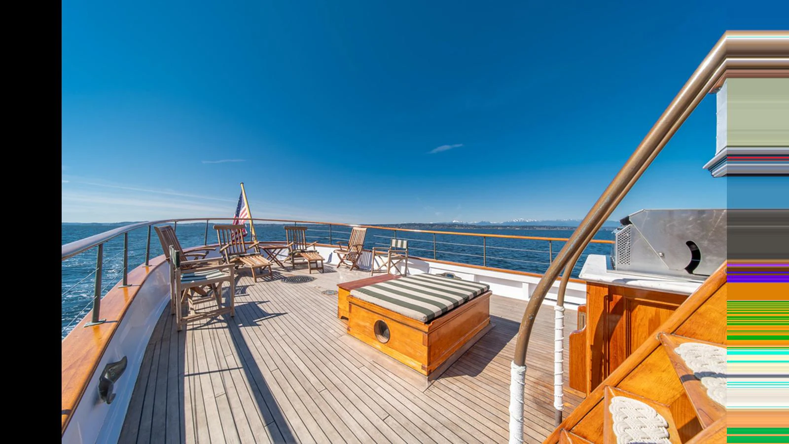 The sundeck offers a spacious area with ample seating and a stunning view of the open sea. aboard BLUE PETER Yacht for Sale