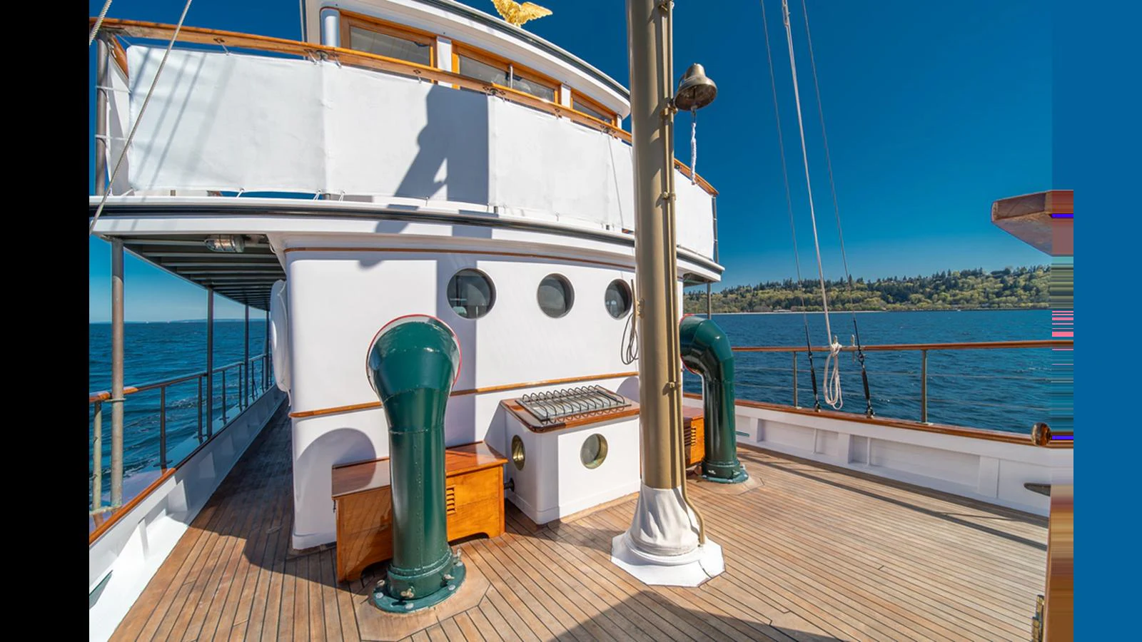 The yacht's deck offers a spacious and inviting area with beautiful woodwork and classic nautical elements. aboard BLUE PETER Yacht for Sale
